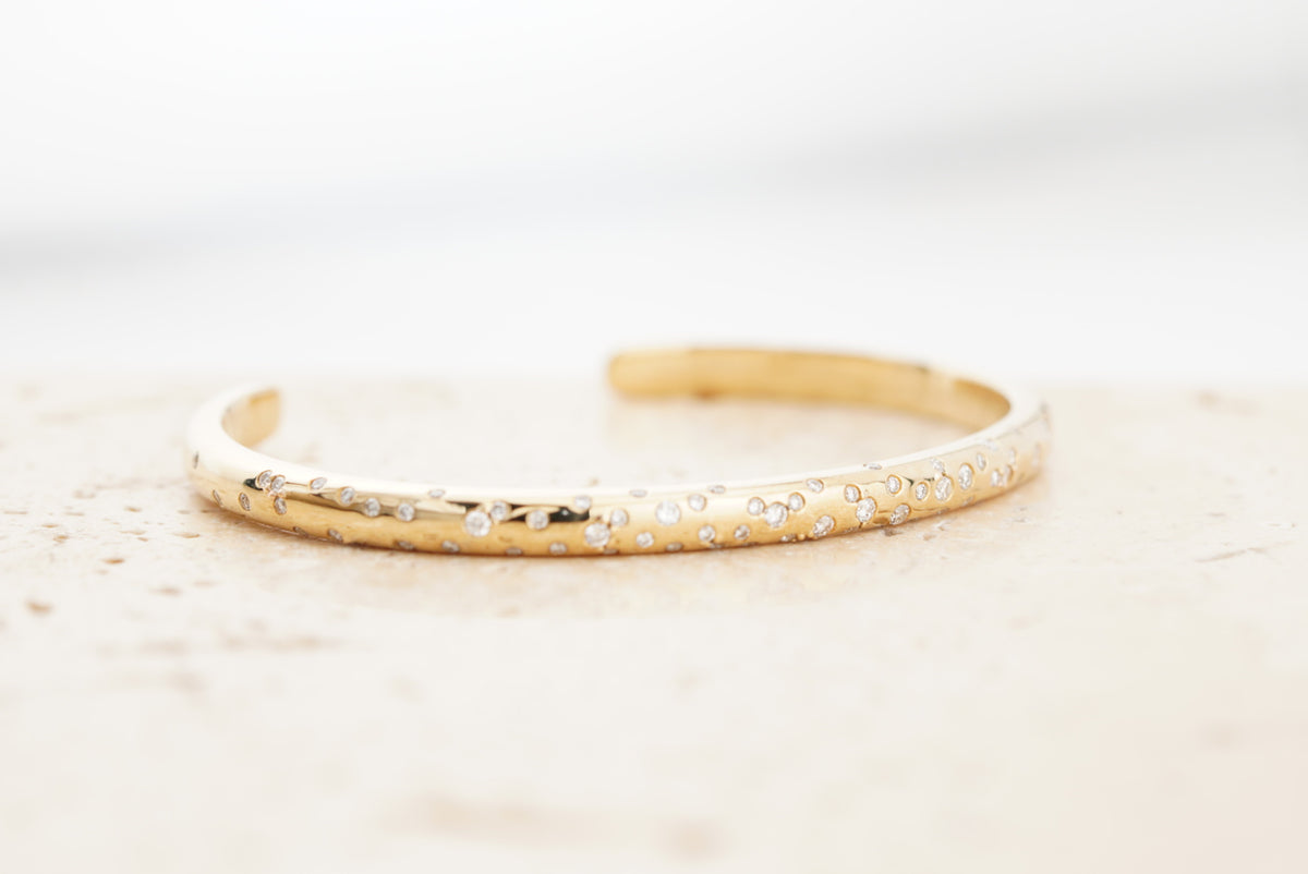 Stella Bracelet, detail of the flush-set diamonds along the band